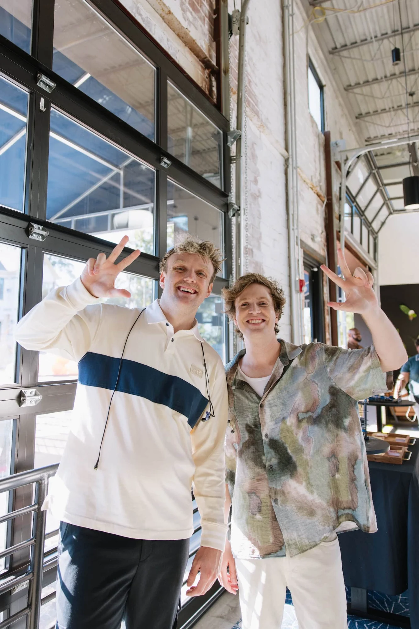 Two people welcoming guests at LIIV Church