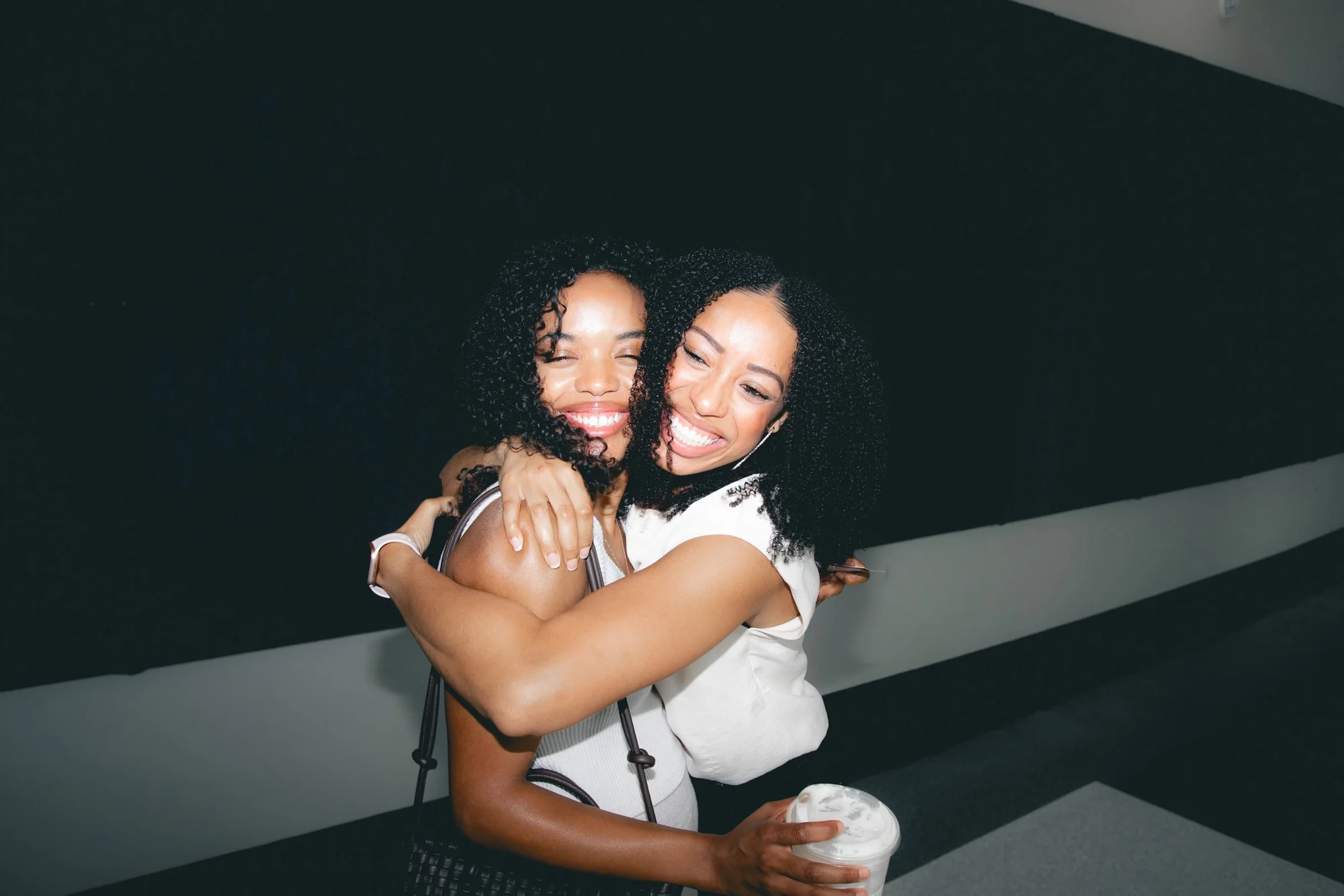 Two friends embracing at LIIV Church