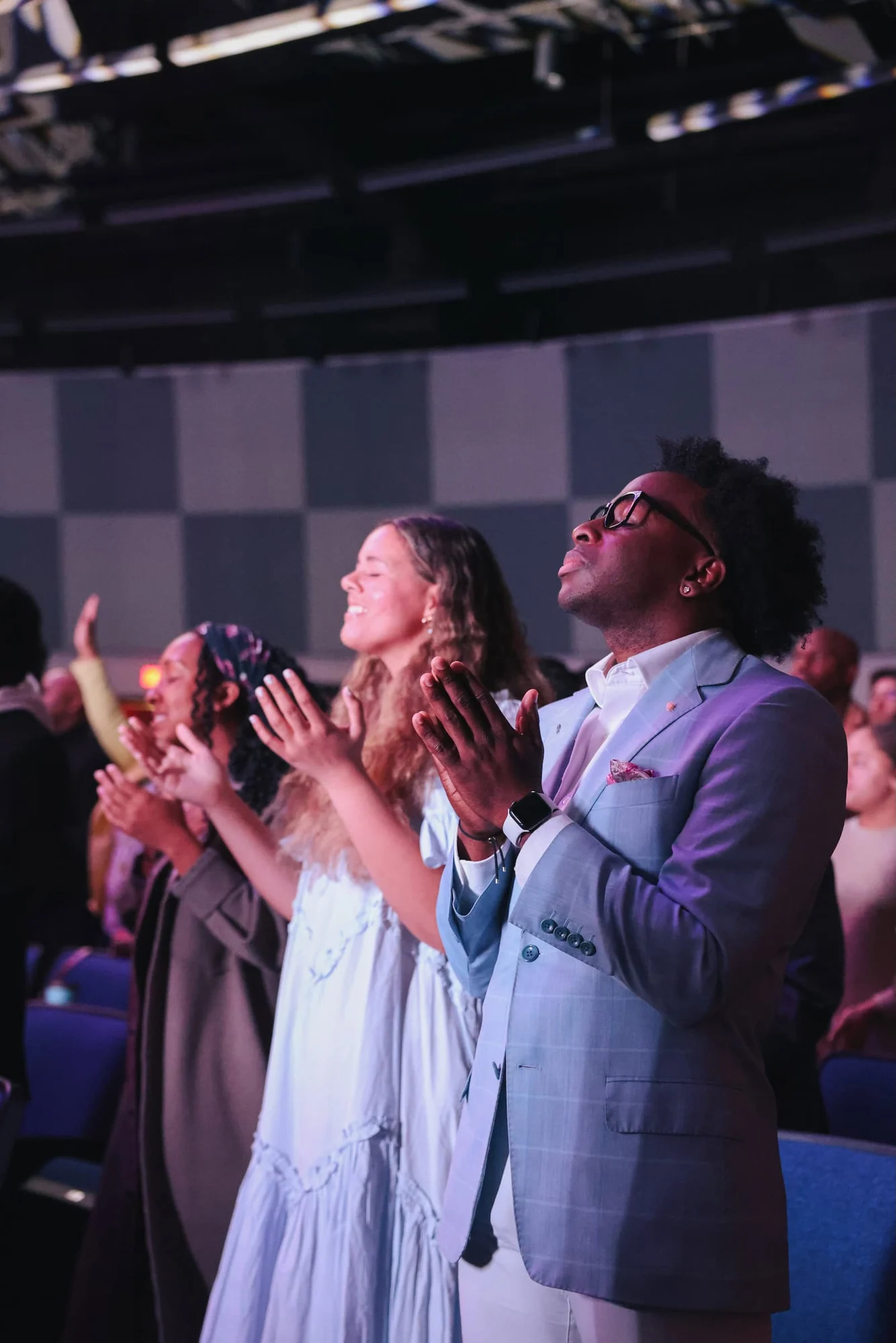 People worshipping together at LIIV Church