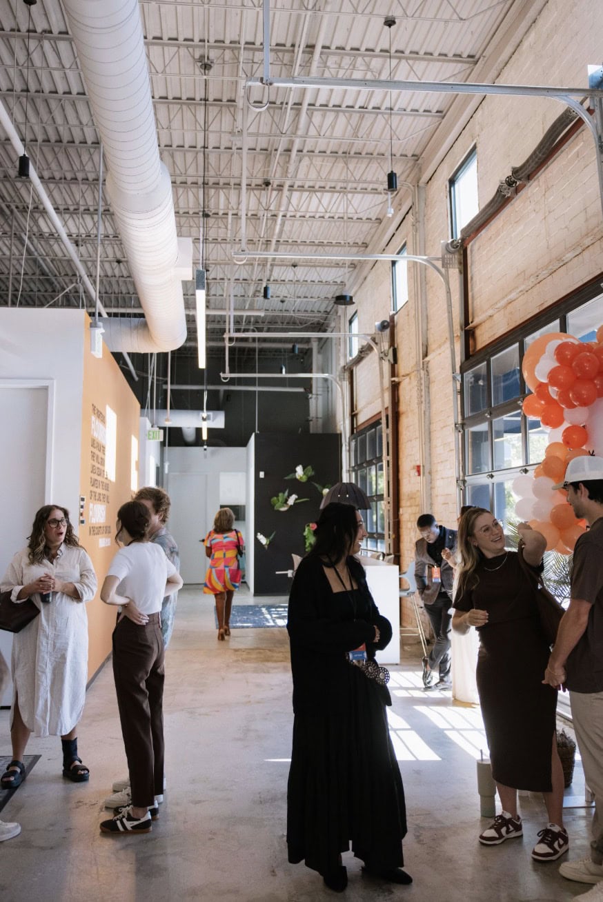 People connecting in the sunlit LIIV foyer